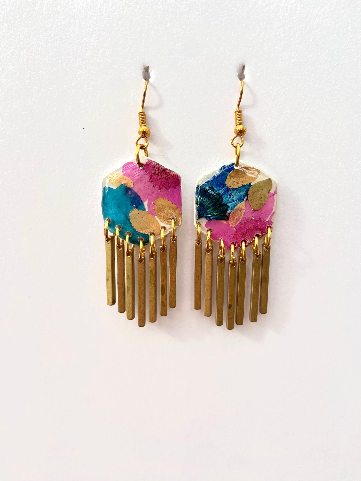 Hexagon floral polymer clay with brass fringe dangle hardware.