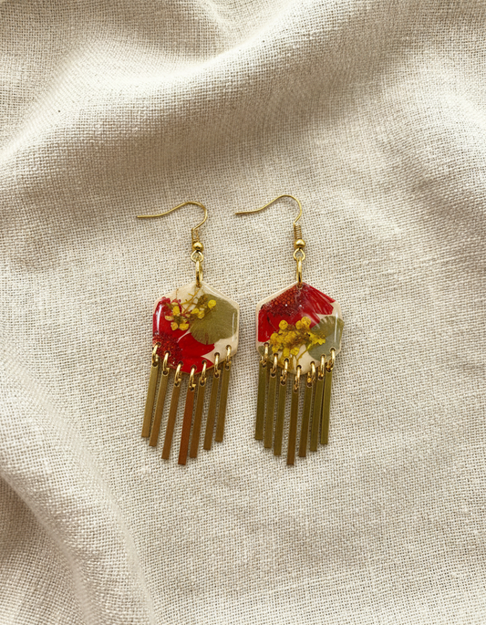 Hexagon floral polymer clay with brass fringe dangle hardware.