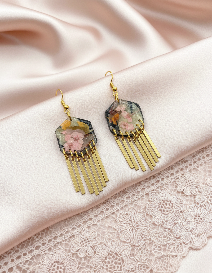 Hexagon floral polymer clay with brass fringe dangle hardware.