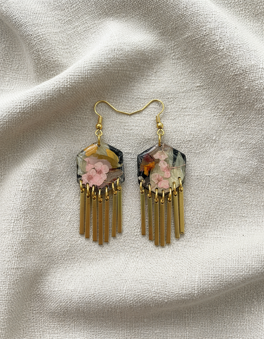 Hexagon floral polymer clay with brass fringe dangle hardware.