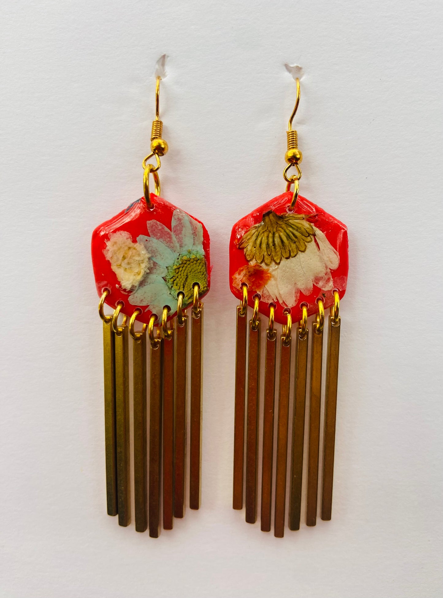 Hexagon floral polymer clay with brass fringe dangle hardware.