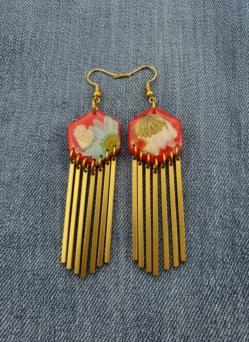 Hexagon floral polymer clay with brass fringe dangle hardware.