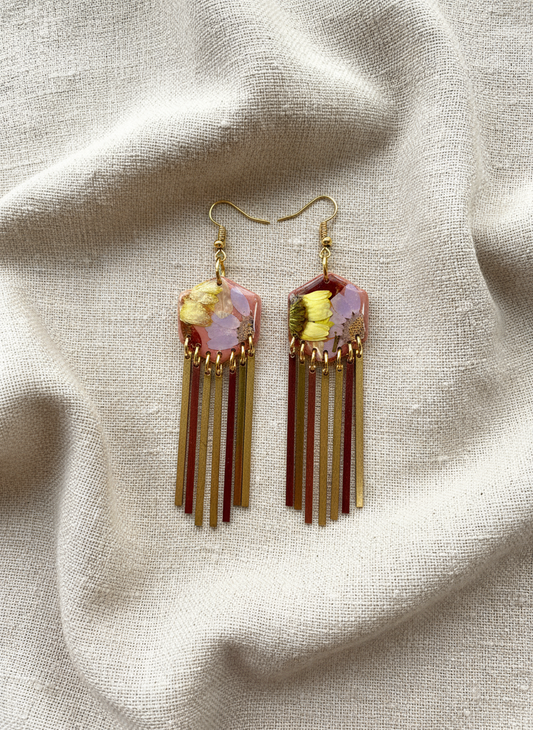 Hexagon floral polymer clay with brass fringe dangle hardware.