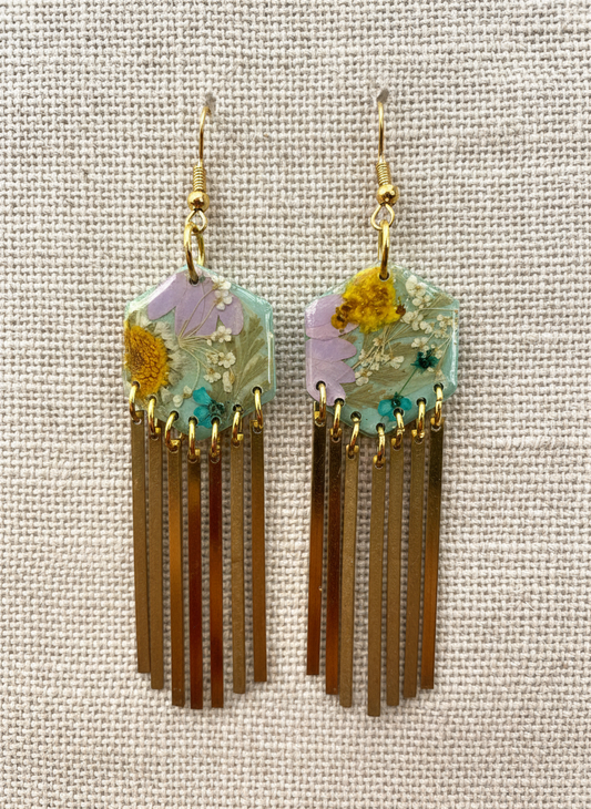 Hexagon floral polymer clay with brass fringe dangle hardware.