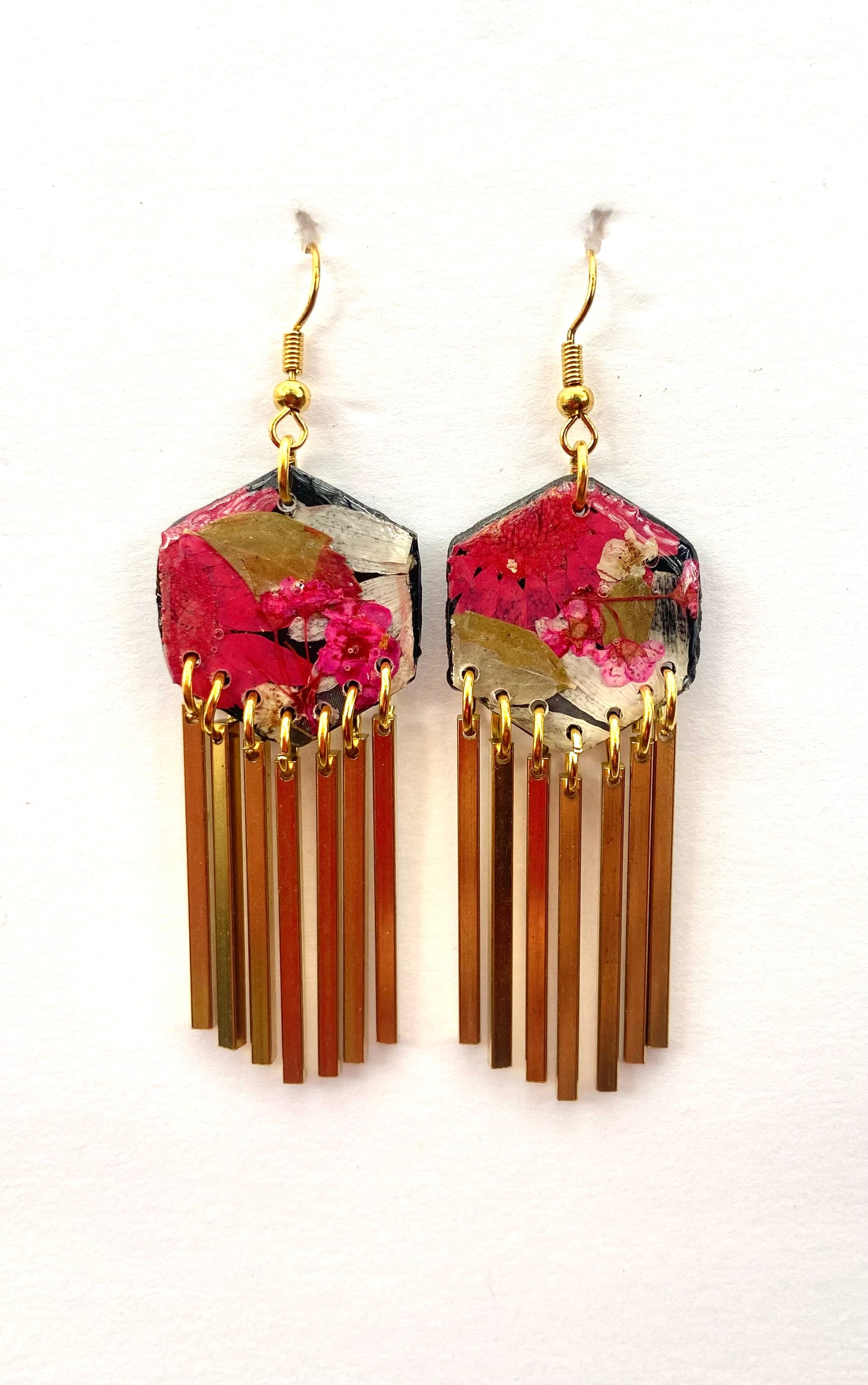 Hexagon floral polymer clay with brass fringe dangle hardware.