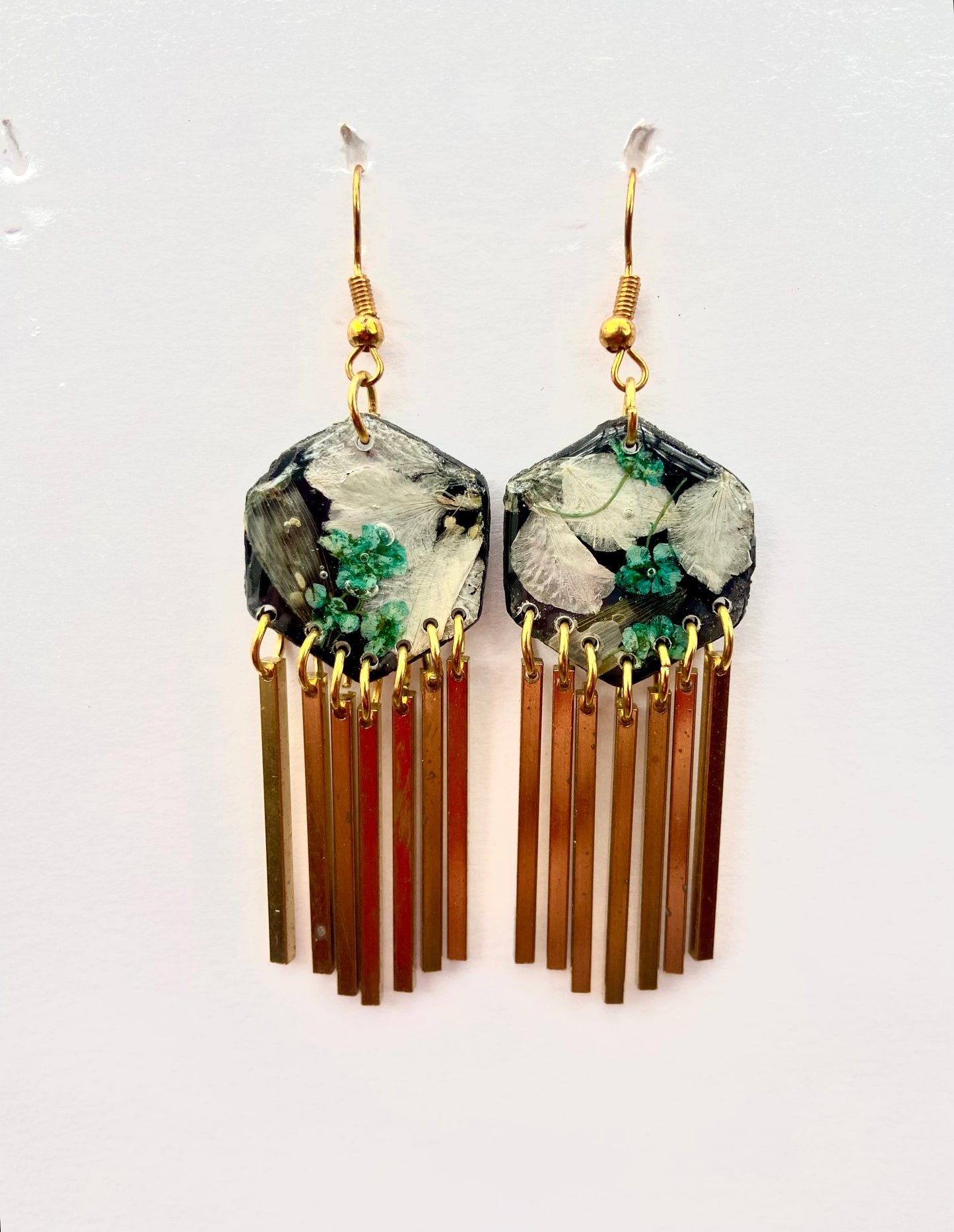Hexagon floral polymer clay with brass fringe dangle hardware.